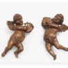 Pareja de figuras en madera tallada reprentando ángeles con instrumentos musicales.